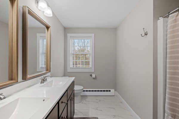 Revital/Line baseboard cover installed in residential bathroom